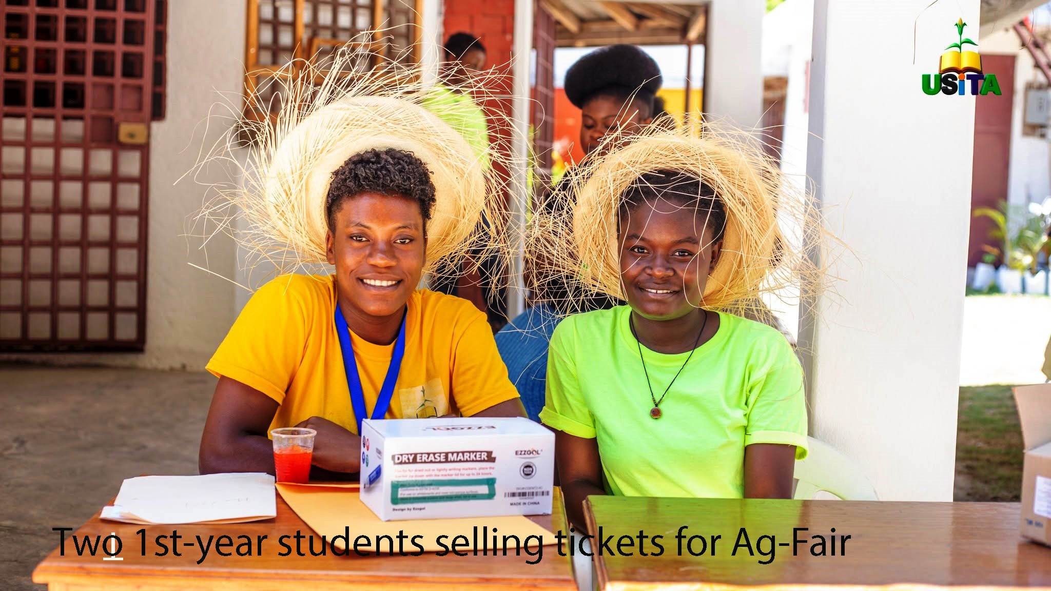 First year students selling tickets for the fair